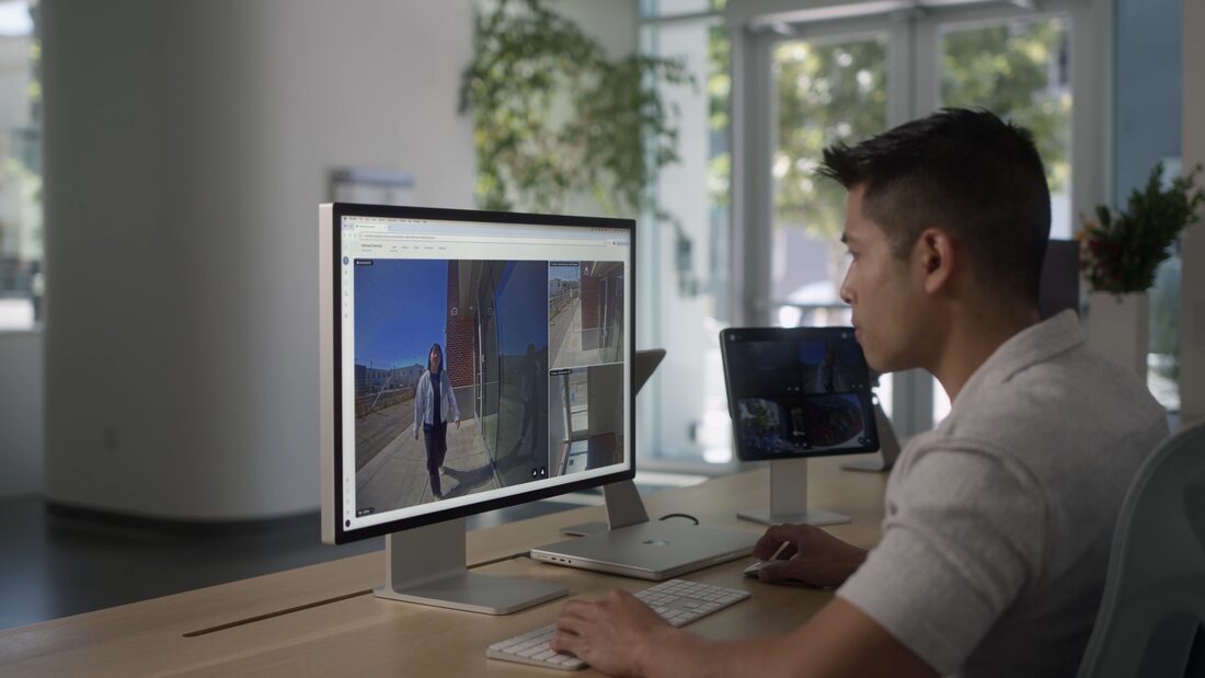 A member of staff watching an incident unfold on a screen