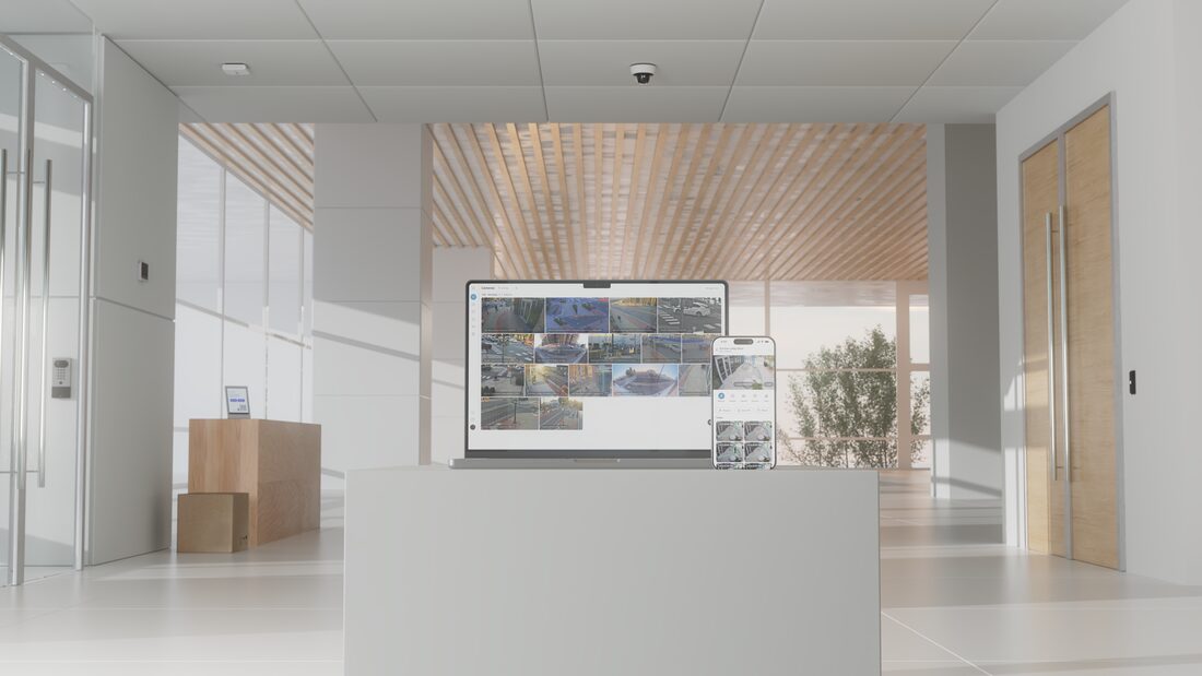 A building reception with camera views on a wall screen