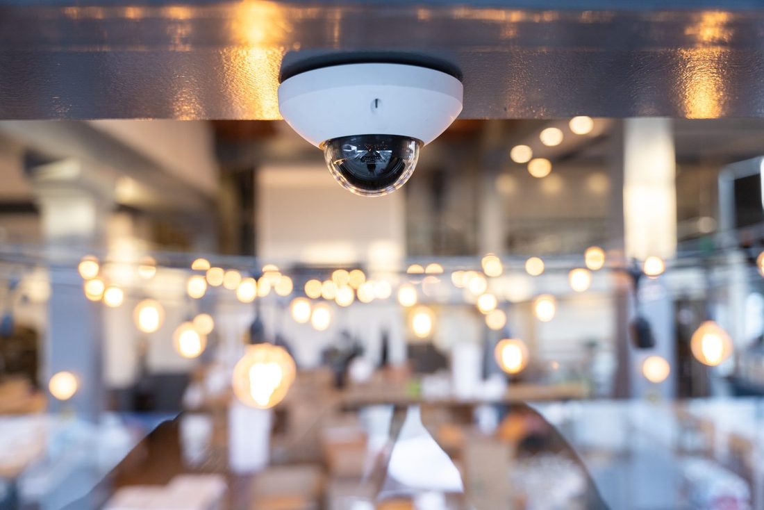 A discreet Verkada dome camera in a hotel interior